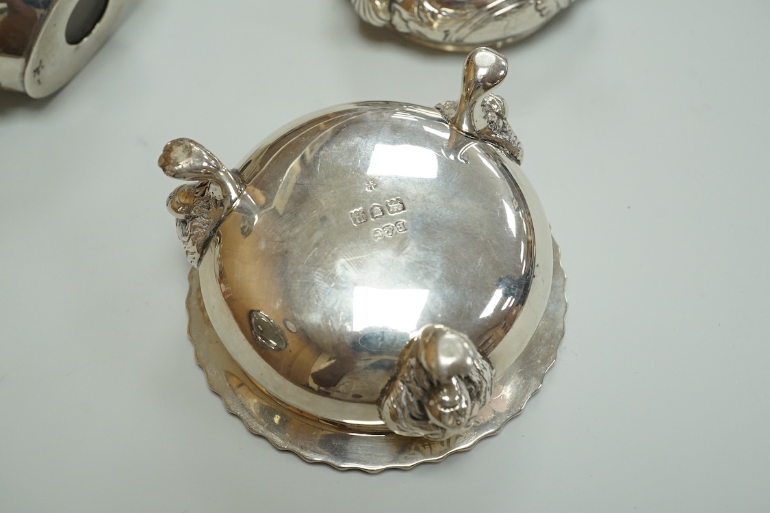 A Victorian silver drum mustard pot, a pair of later silver mustard pots and two silver salts including Victorian.